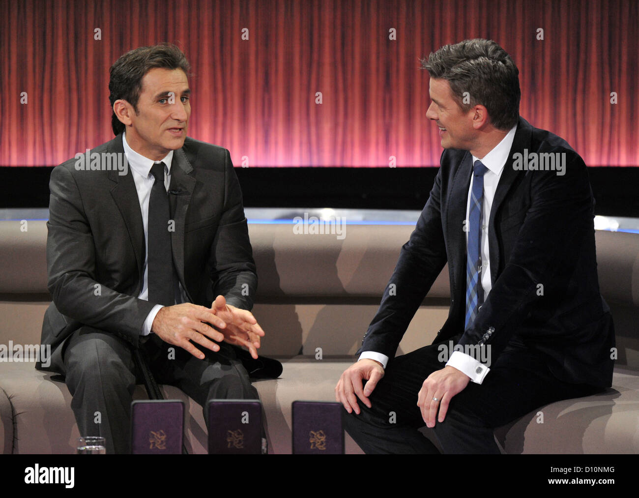 Italian raceing car driver and Olympic winner, Alessandro Zanardi (L), attends the annual review show 'Menschen 2012' (People of 2012) hosted by talk show host Markus Lanz (R) and aired on public television broadcasting station ZDF in Munich, Germany, 2 December 2012, Photo: Marc Mueller Stock Photo