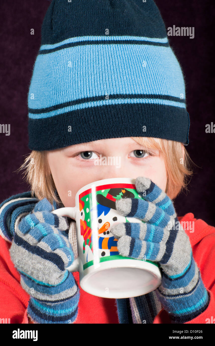 Child with warm drink Stock Photo Alamy