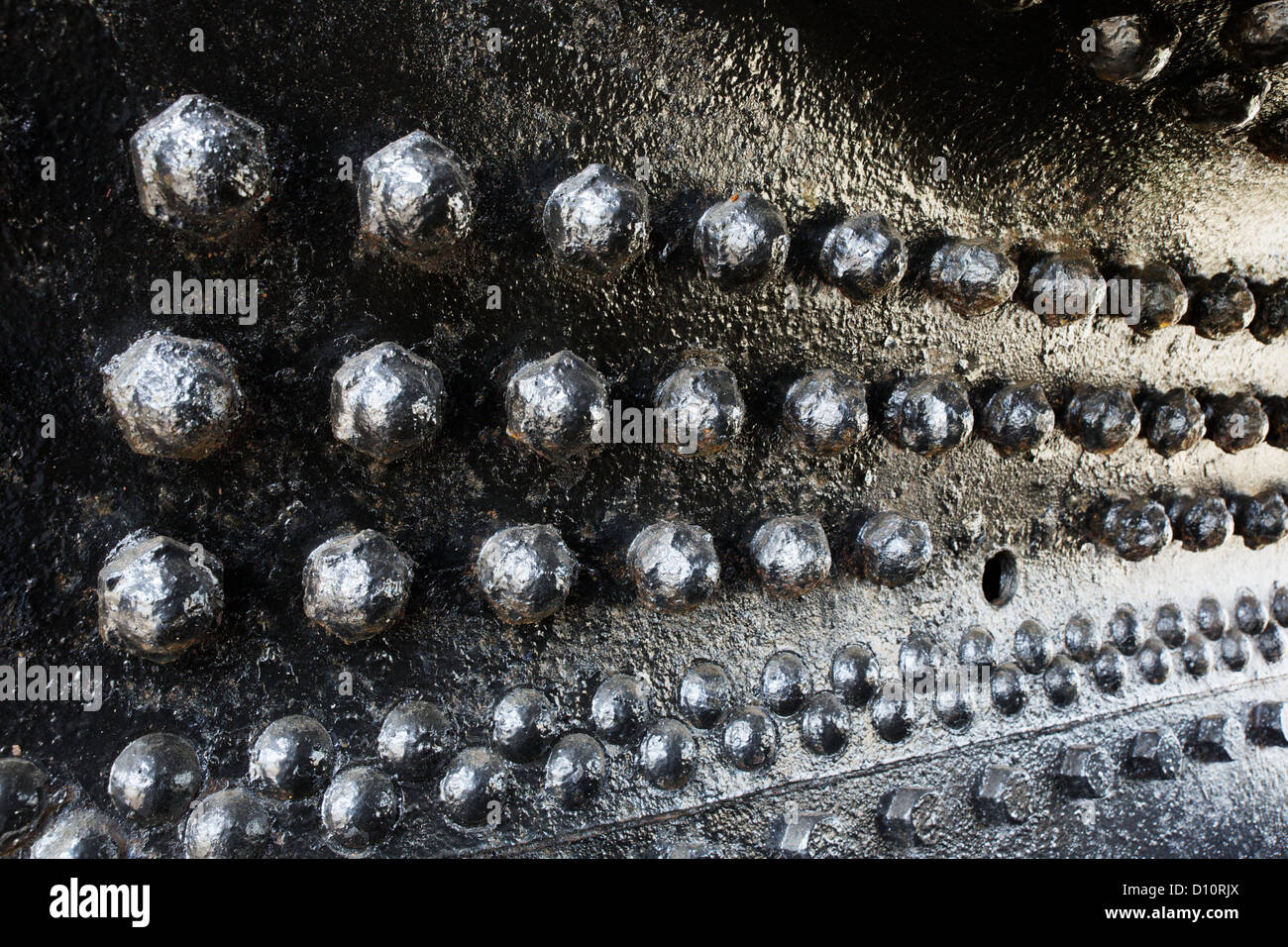 Black rivets in perspective on a train engine boiler Stock Photo - Alamy