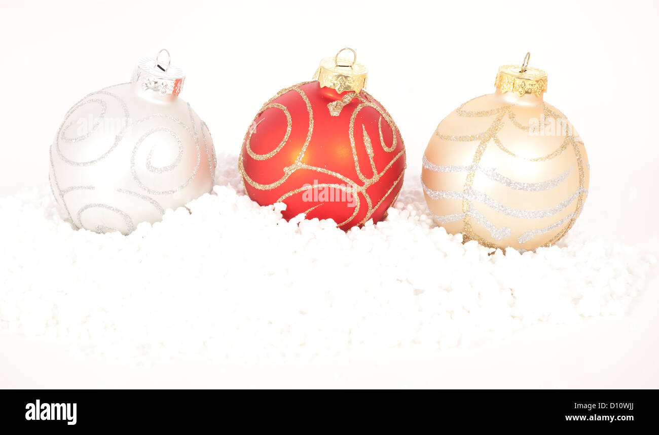 Red and gold Christmas baubles on golden background Stock Photo - Alamy