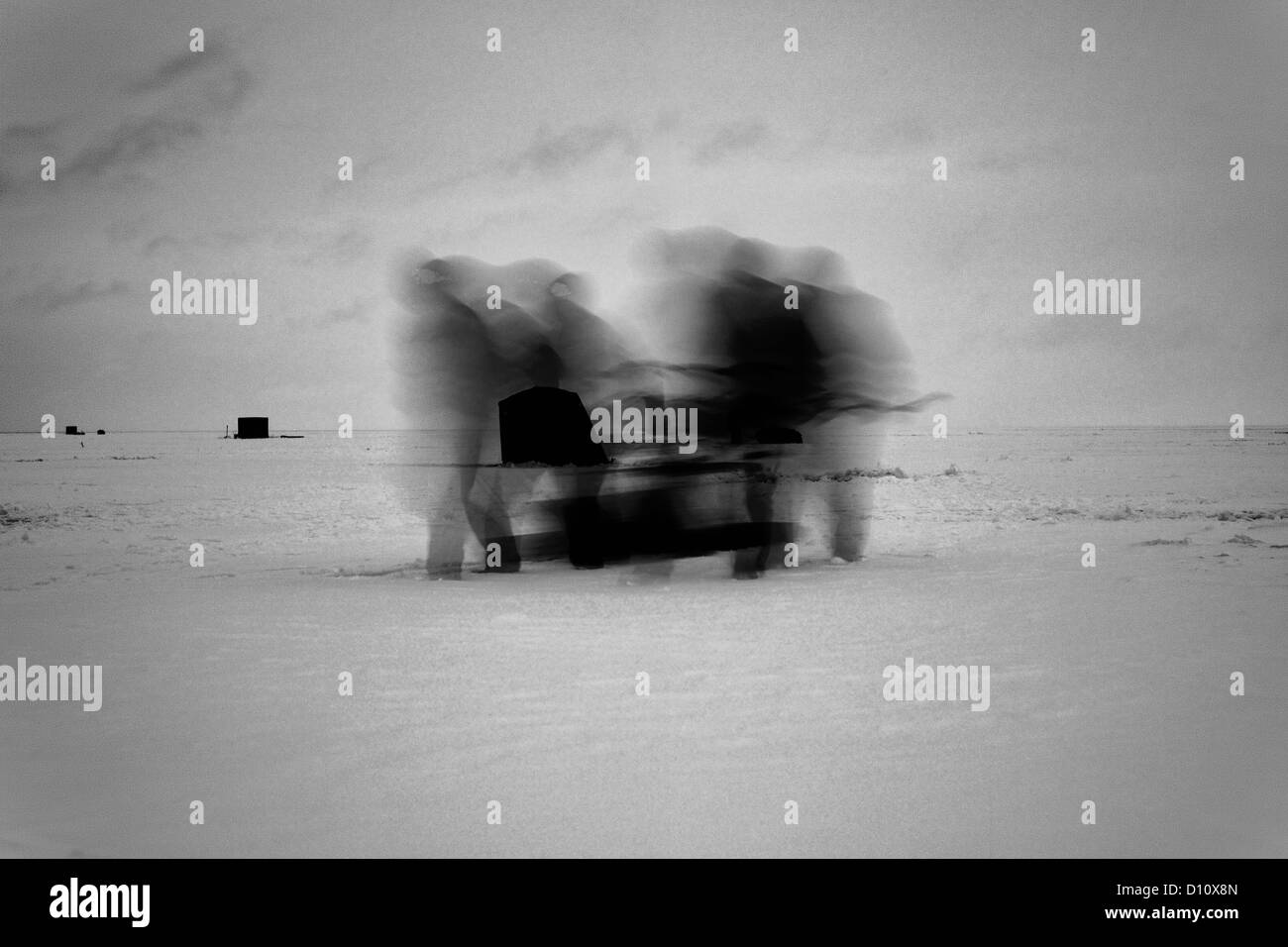 Blurred motion of people walking on snow Stock Photo