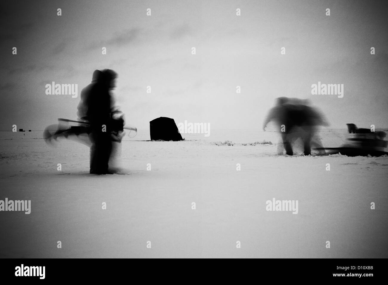Blurred motion of people walking on snow Stock Photo