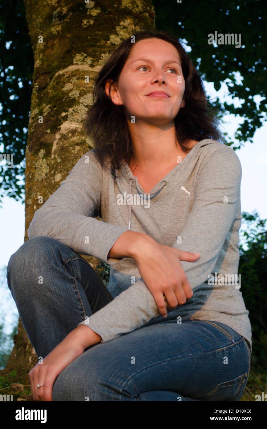 Young woman watching sunset hi-res stock photography and images - Alamy