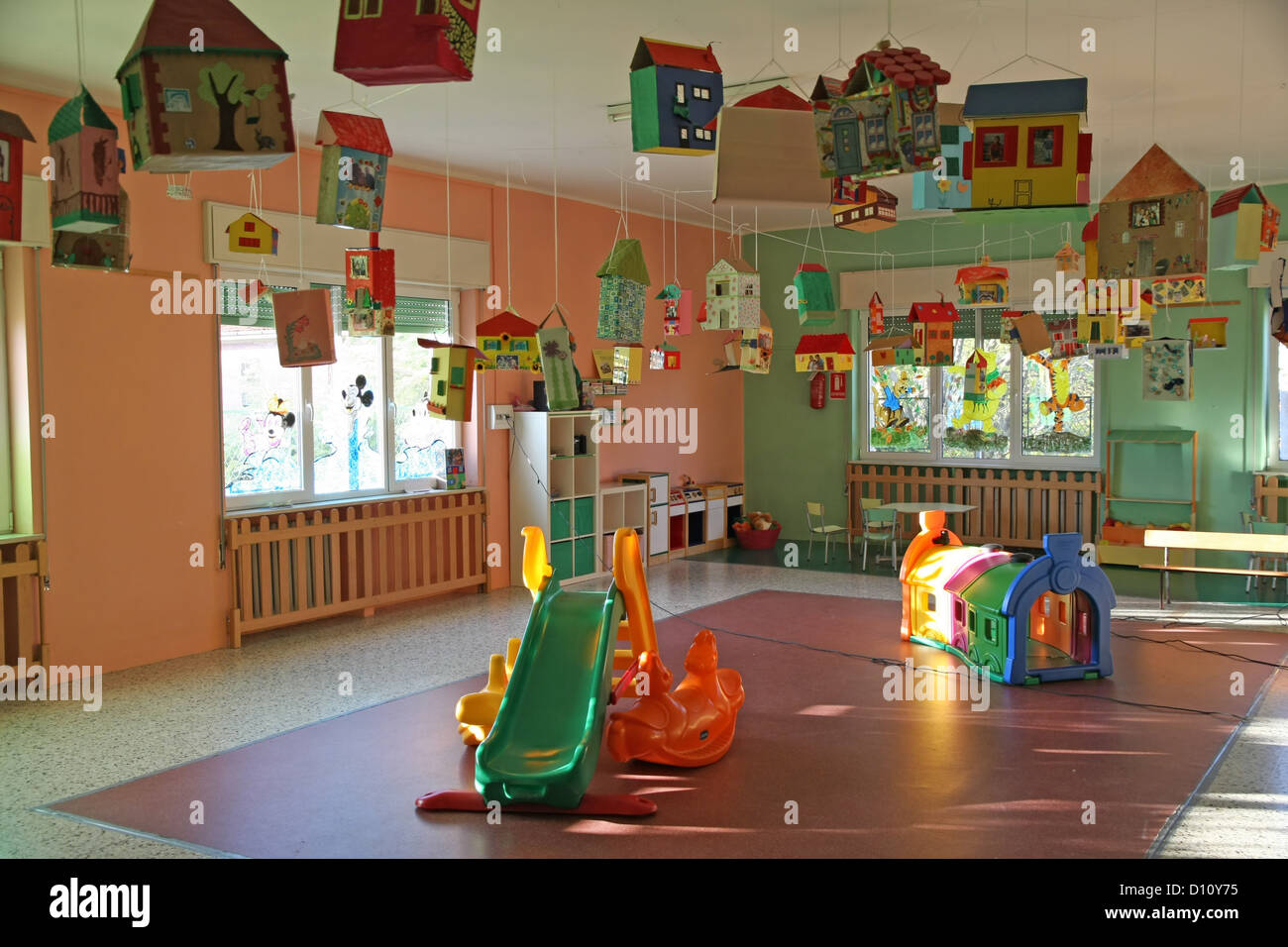 large living room full of games and slides of a nursery Stock Photo