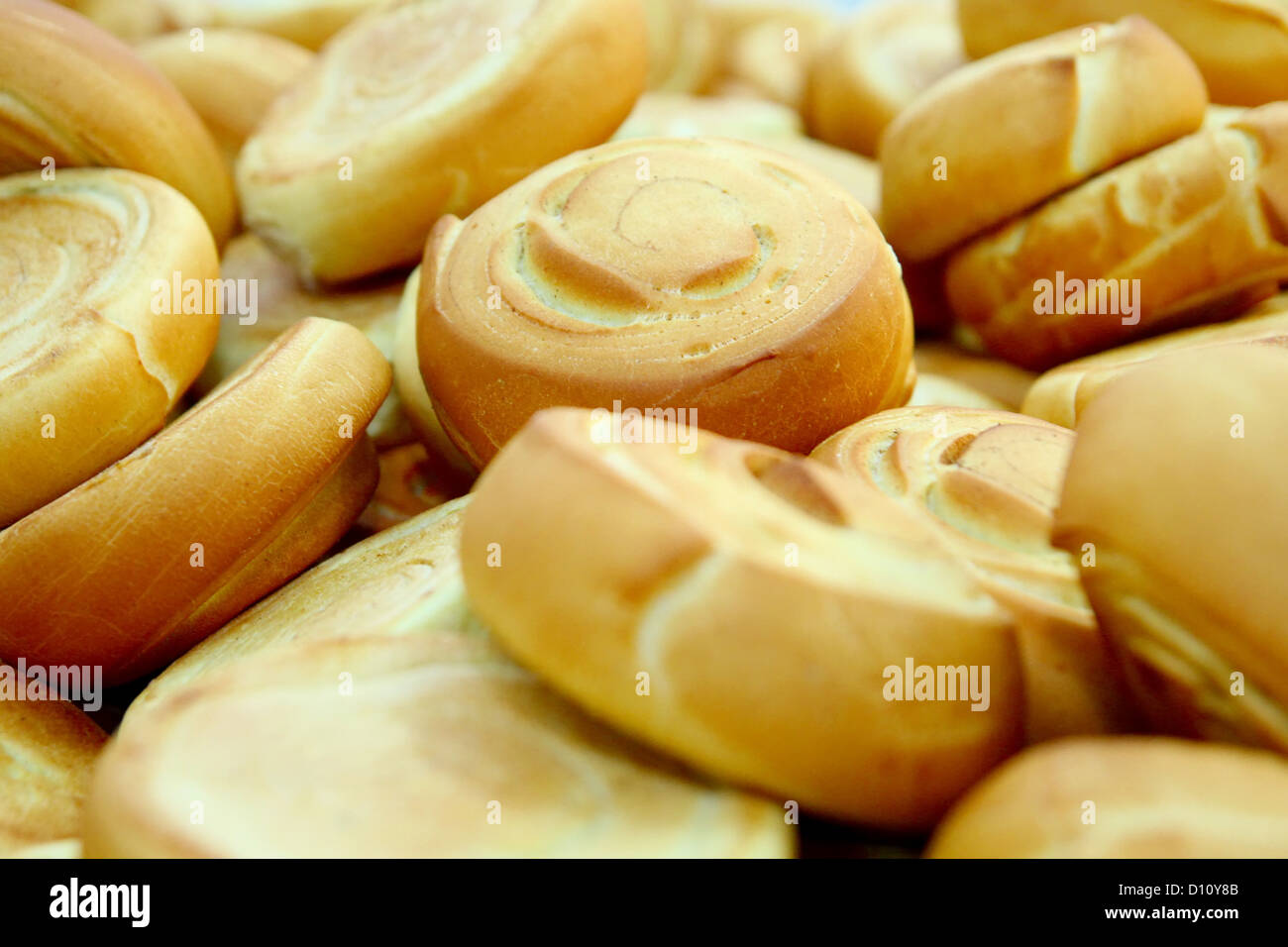 Many fresh baked rolls in a industrial bakery Stock Photo Alamy