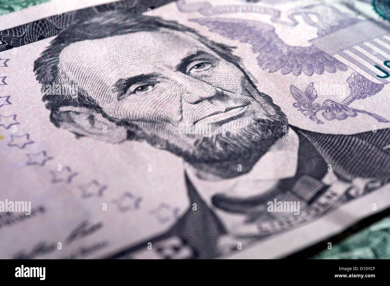Detail of Abraham Lincoln portrait on a five  US dollar bill Stock Photo