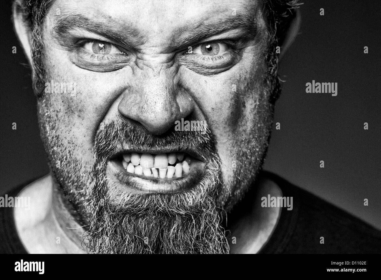 Angry man with sneer on his face. Stock Photo