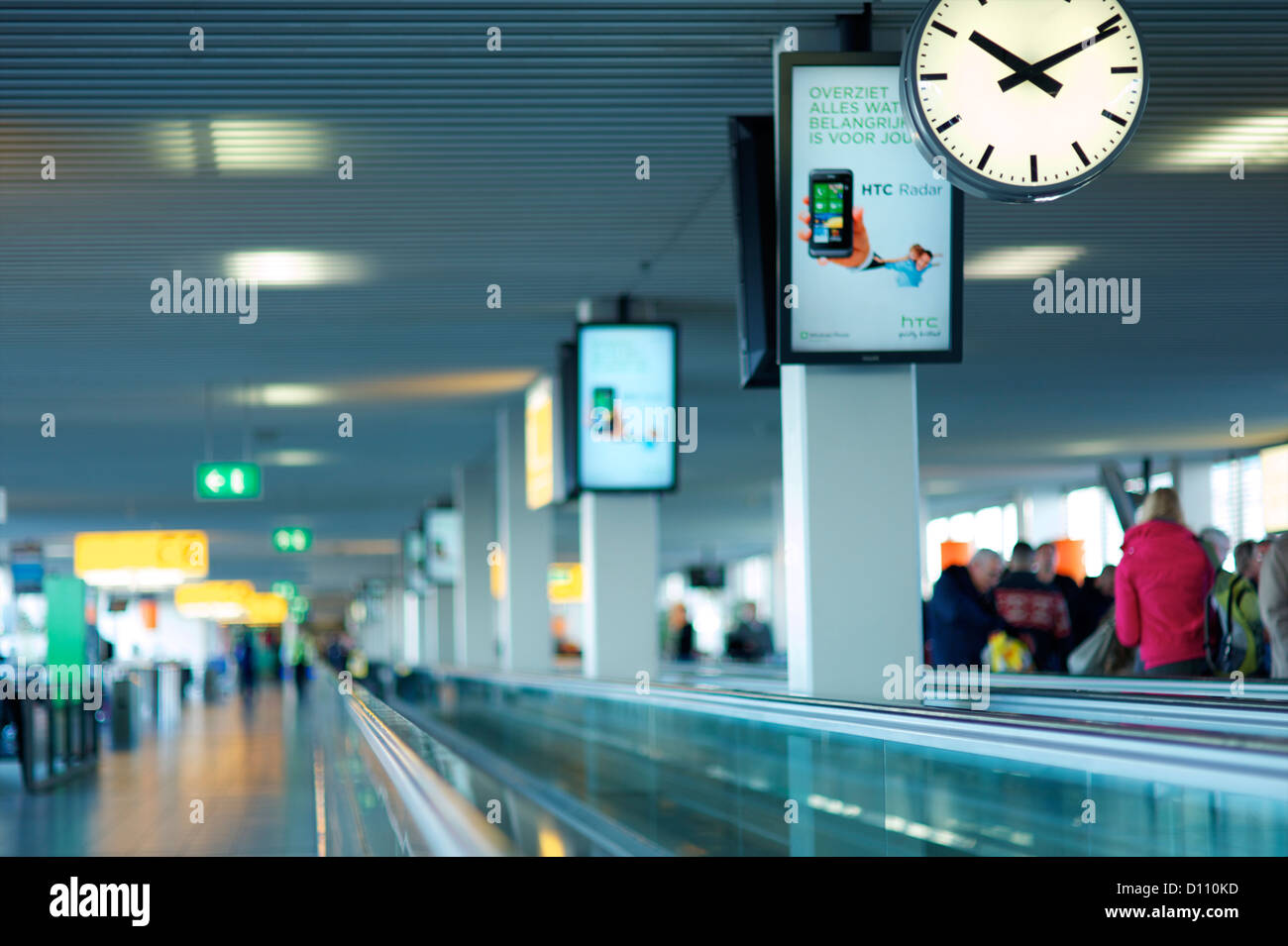 Conveyor belt in airport with people in the distance. Stock Photo