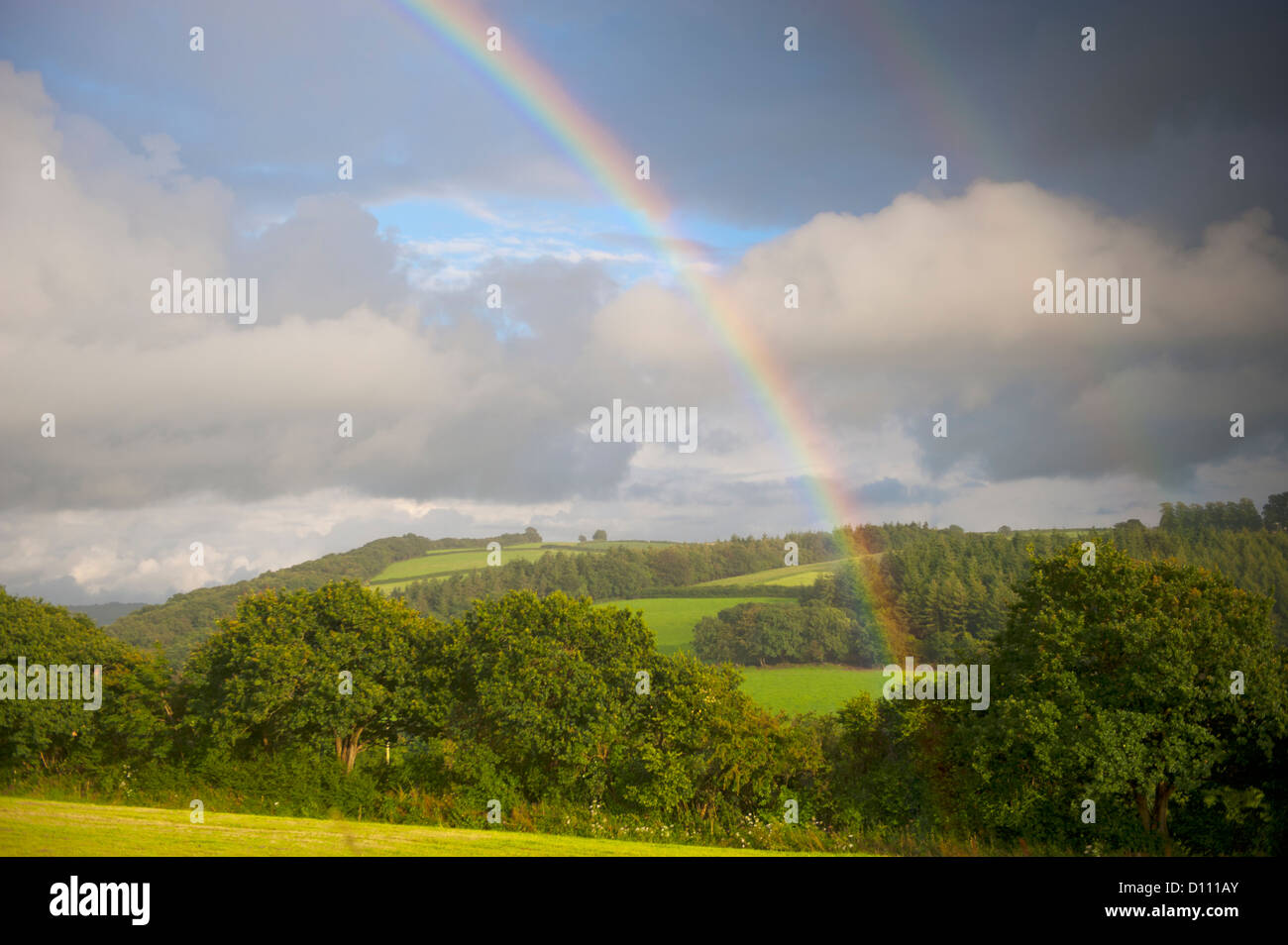 Rainbow over farmland in North Cornwall. Stock Photo