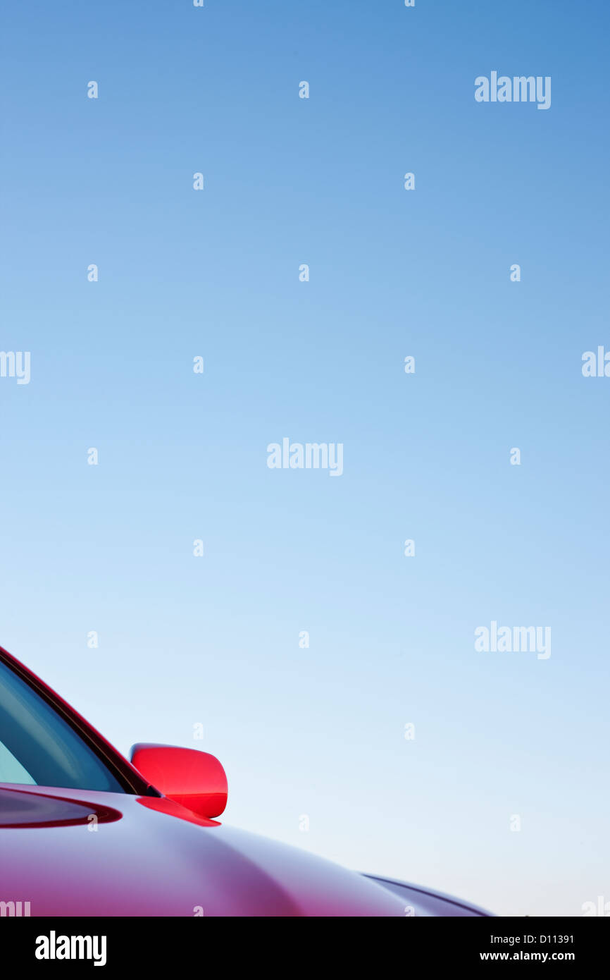 Driver Side Mirror and Hood of Red Car Stock Photo - Alamy