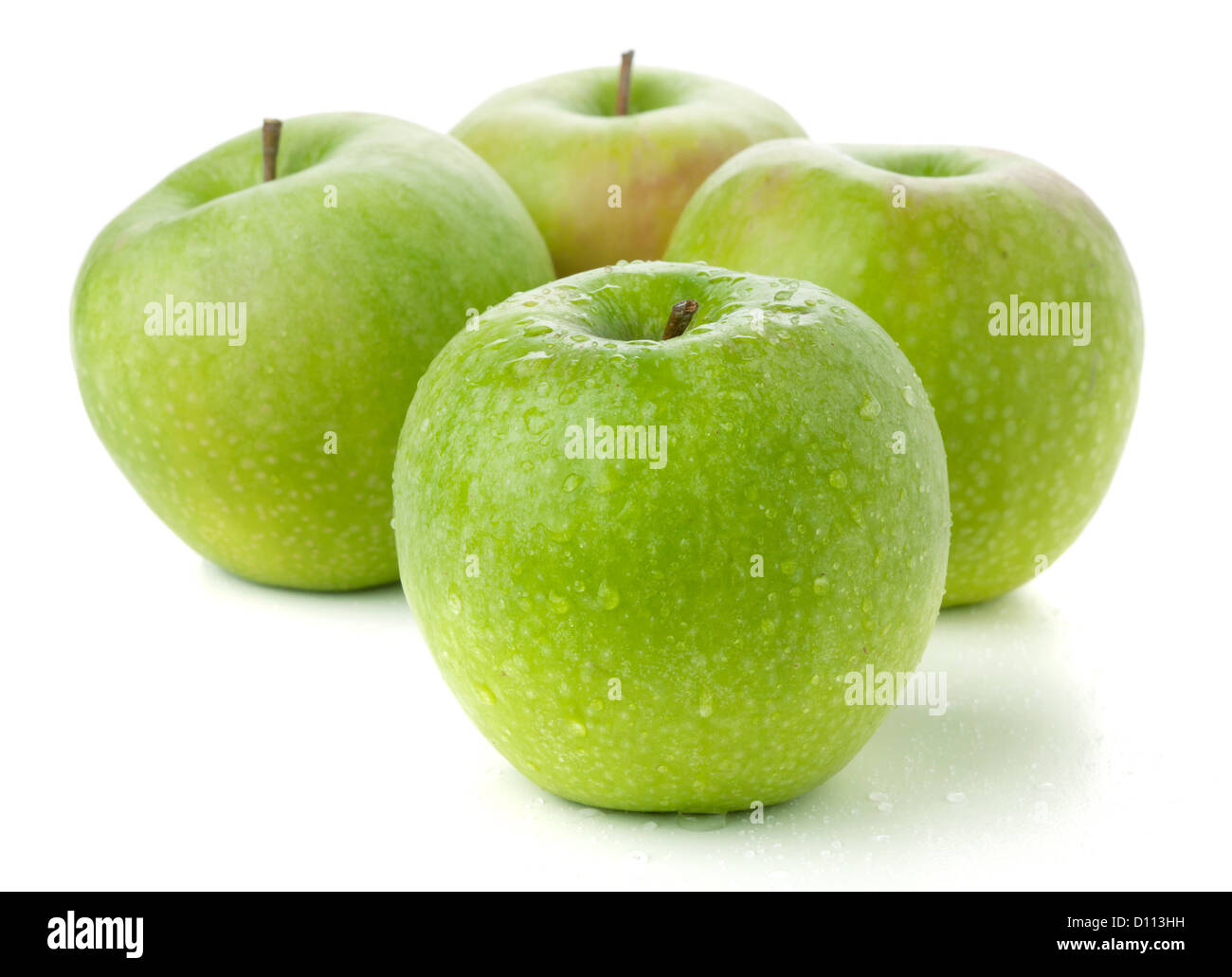 Four ripe green apples. Isolated on white Stock Photo