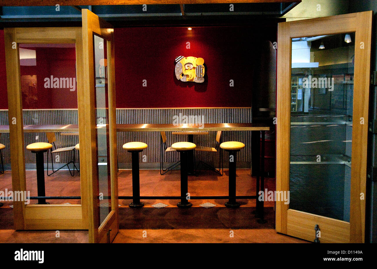 Entrance to fast food restaurant with long table and stools for fast service on Grand Avenue. St Paul Minnesota MN USA Stock Photo