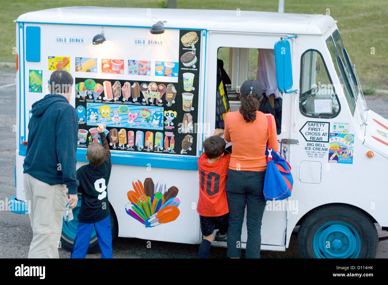 Children with parents patronizing a mobile ice cream truck. St Paul Minnesota MN USA Stock Photo