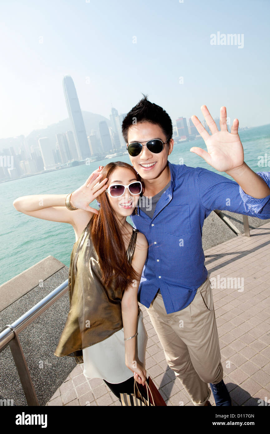 Fashionable young couple enjoying the Victoria Harbor, Hong Kong Stock ...