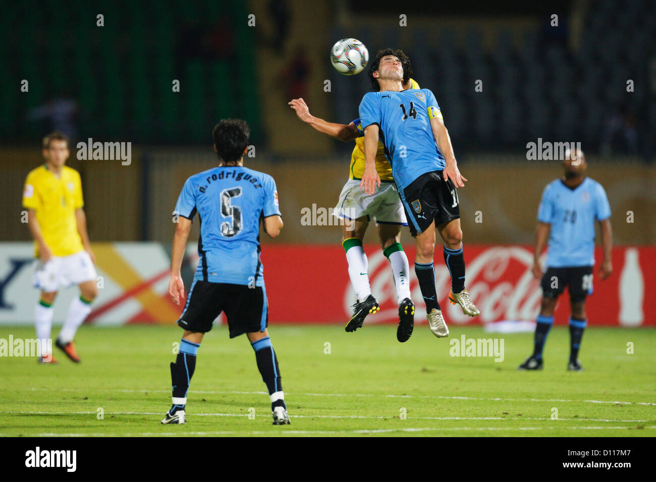 Uruguay team captain Nicolas Lodeiro (14) jumps for a header during the 2009 FIFA U20 World Cup round of 16 match against Brazi Stock Photo