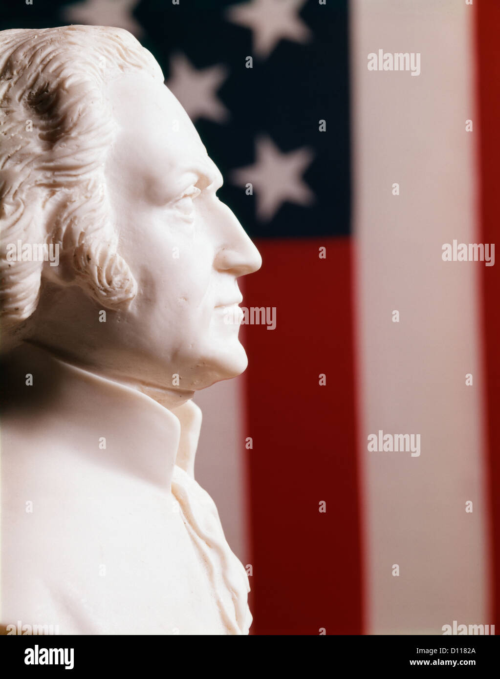 PROFILE WHITE PLASTER BUST STATUE GEORGE WASHINGTON AMERICAN PRESIDENT STARS FLAG BACKGROUND Stock Photo