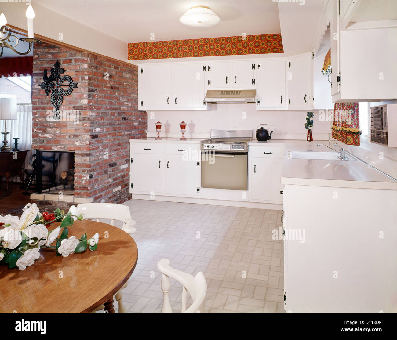 1960s Kitchen Interior With Brick Wall And White Country Cabinets