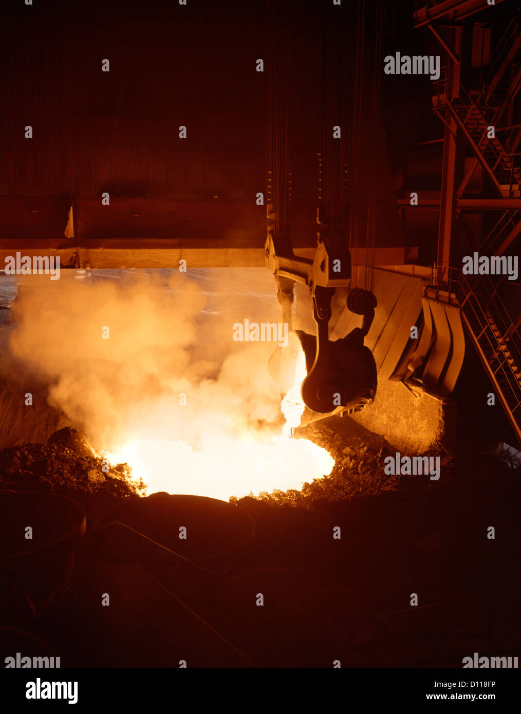 INTERIOR OF STEEL MILL WITH MOLTEN STEEL BEING POURED FROM CRUCIBLE Stock Photo Alamy