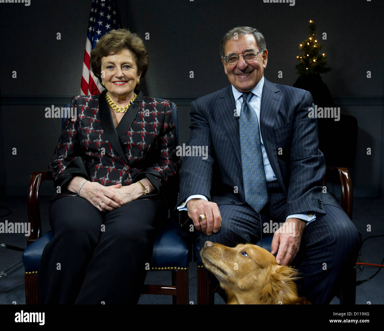 US Secretary of Defense Leon Panetta and his wife Sylvia tape a holiday message to the troops at the Pentagon, December 4 2012 in Arlington, VA. Stock Photo