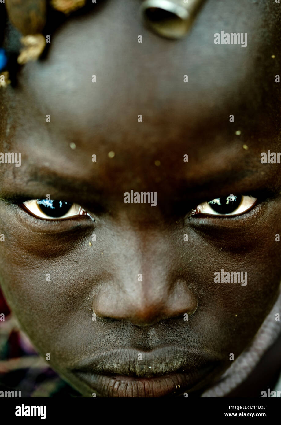 Close Up Portrait Of A Mursi Tribe Kid Face In Mago National Park, Omo Valley, Ethiopia Stock Photo
