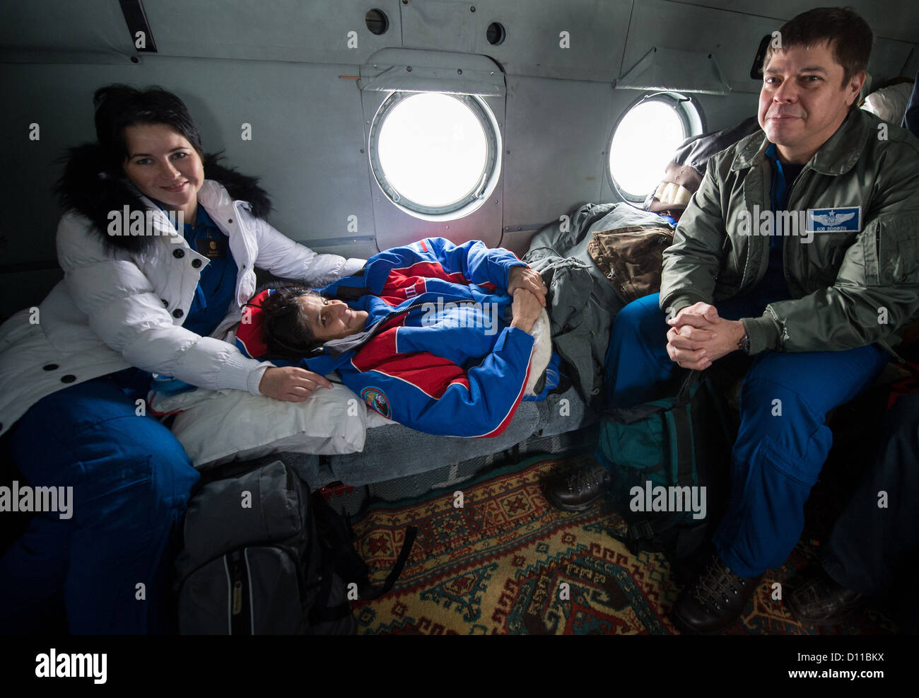 Expedition 33 Commander Sunita Williams of NASA rests during a ...