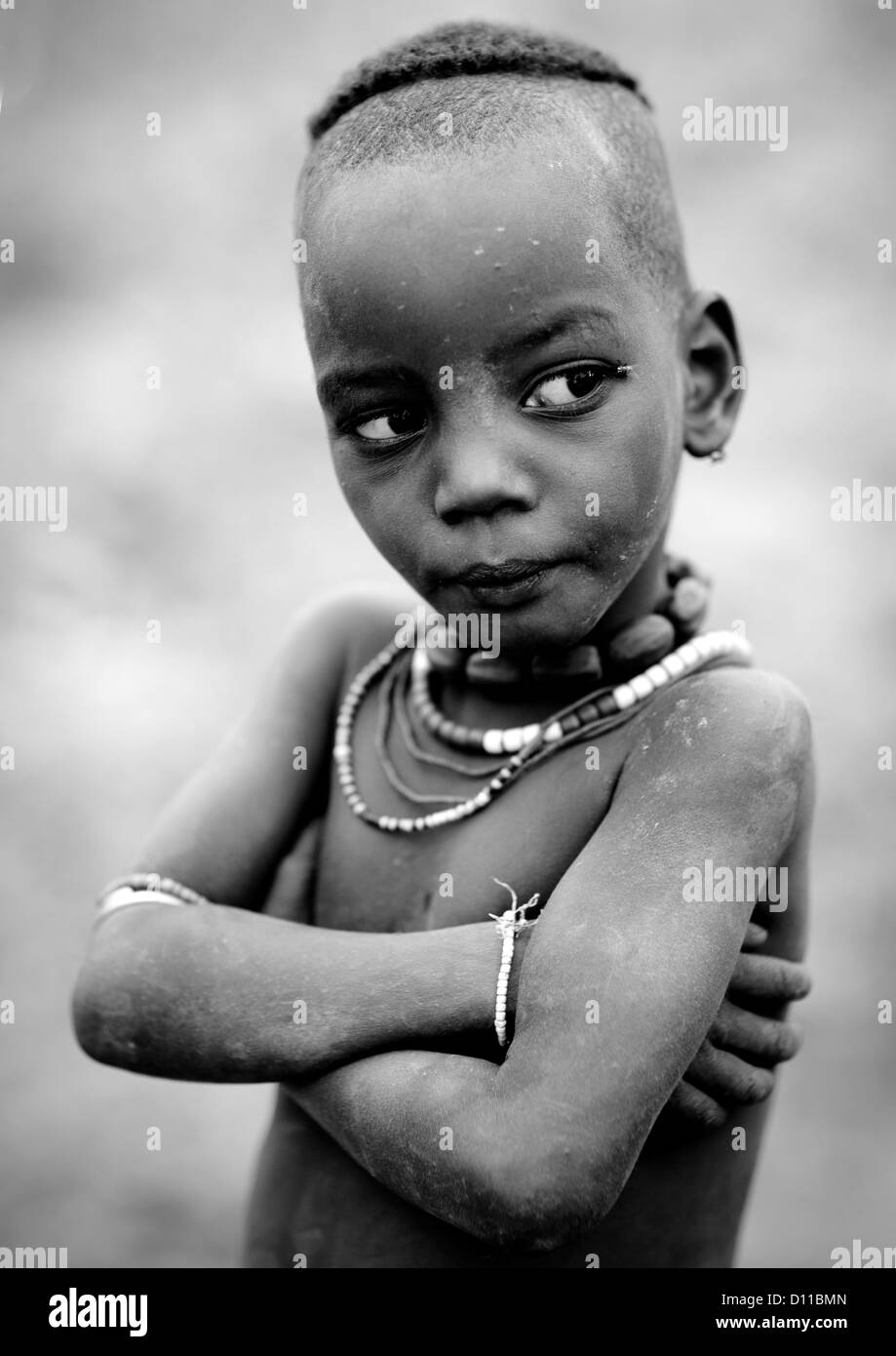 Serious Hamar Tribe Kid With 50 Cent Chain, Turmi, Omo Valley, Ethiopia Stock Photo