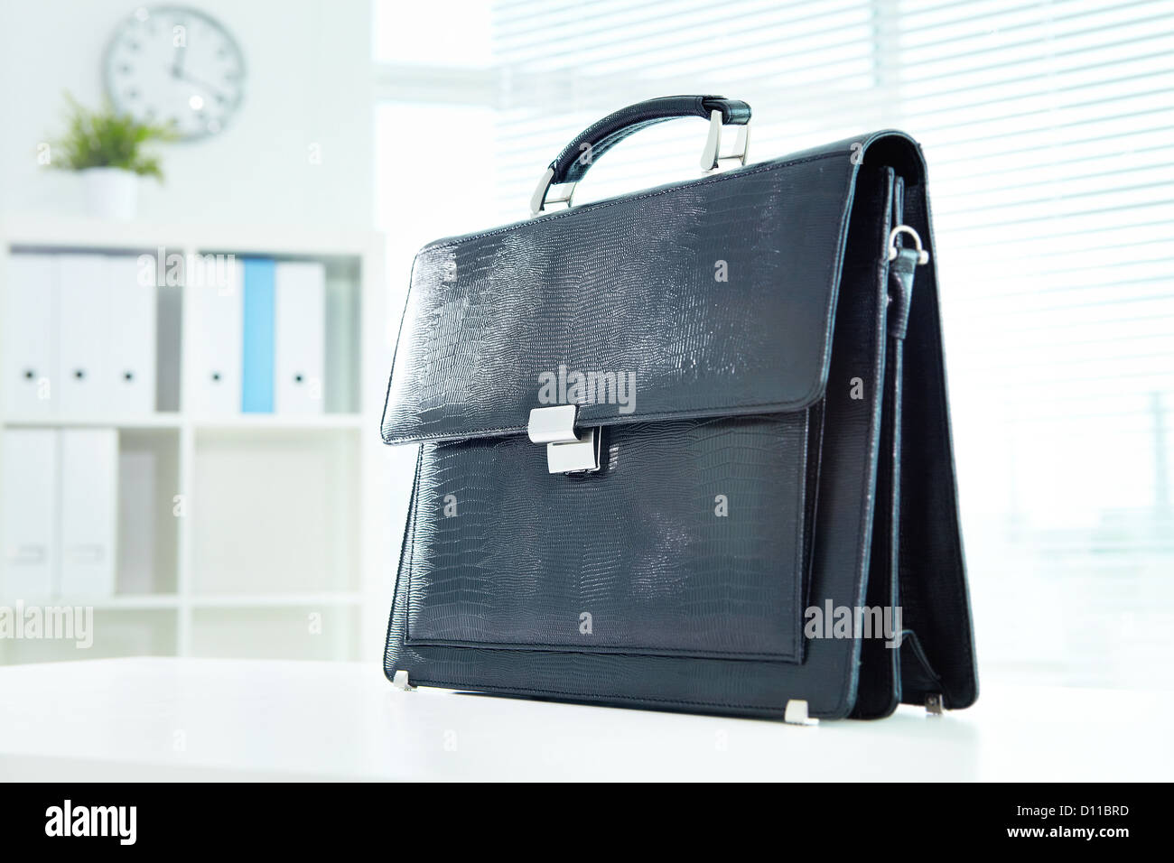 Image of black leather briefcase on desk in office Stock Photo Alamy
