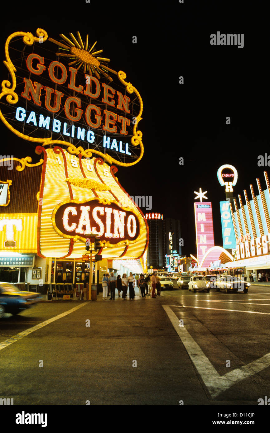 1970s FREMONT STREET DOWNTOWN LAS VEGAS NEVADA AT NIGHT WITH NEON OF GOLDEN  NUGGET HORSESHOE AND MINT CASINOS Stock Photo - Alamy