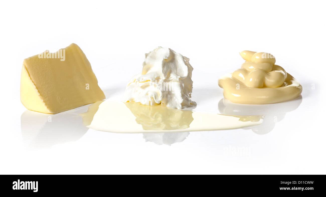 Butter, whipped cream, oil and mayonnaise on white background. Low Carb Hi Fat-diet. LCHF. Stock Photo