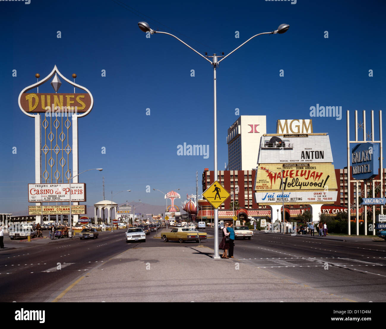 1970s 1980s THE STRIP LAS VEGAS DAYTIME Y SHAPED STREETLIGHT THE DUNES CASINO SIGN MGM HILTON BARBARY COAST Stock Photo
