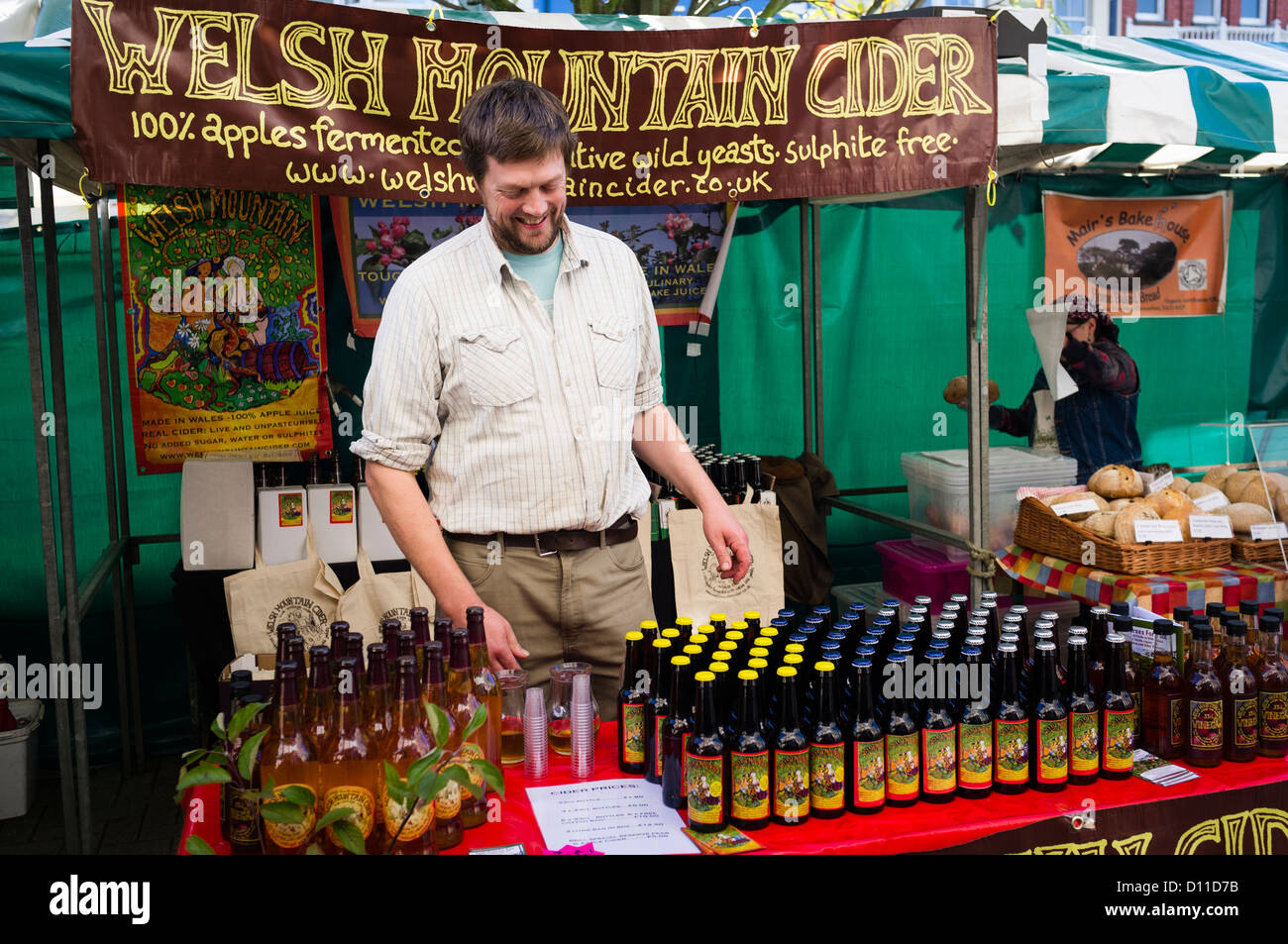 A man selling his home made Welsh Mountain Cider on Aberystwyth street market October 20 2012 Stock Photo