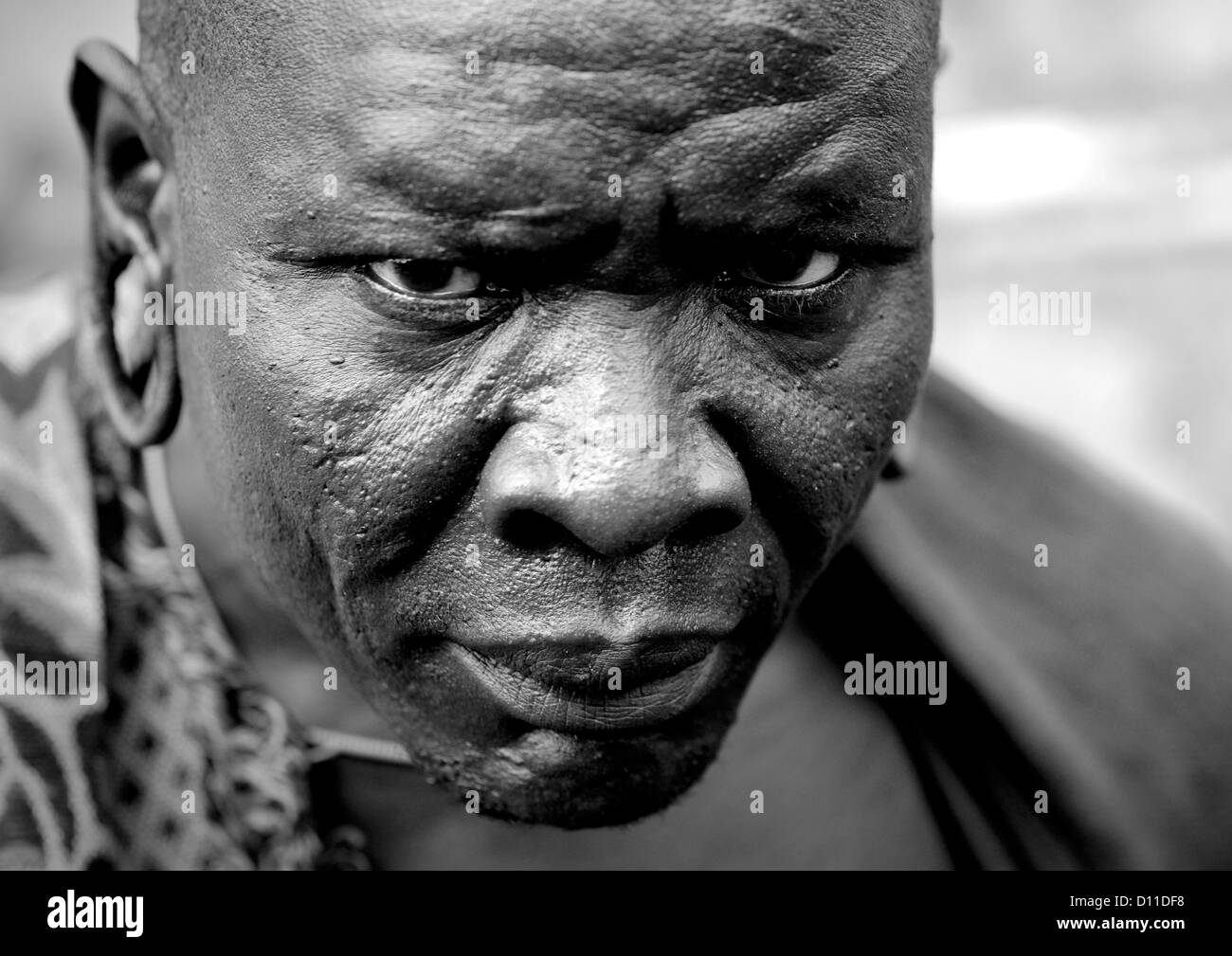 Black And White Portrait Of Surma Tribe Warrior With Enlarged Ears, Tulgit, Omo Valley, Ethiopia Stock Photo