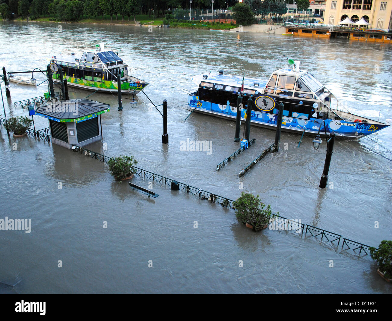 A view of the flooded river banks of Pò river with touristic boats. Stock Photo