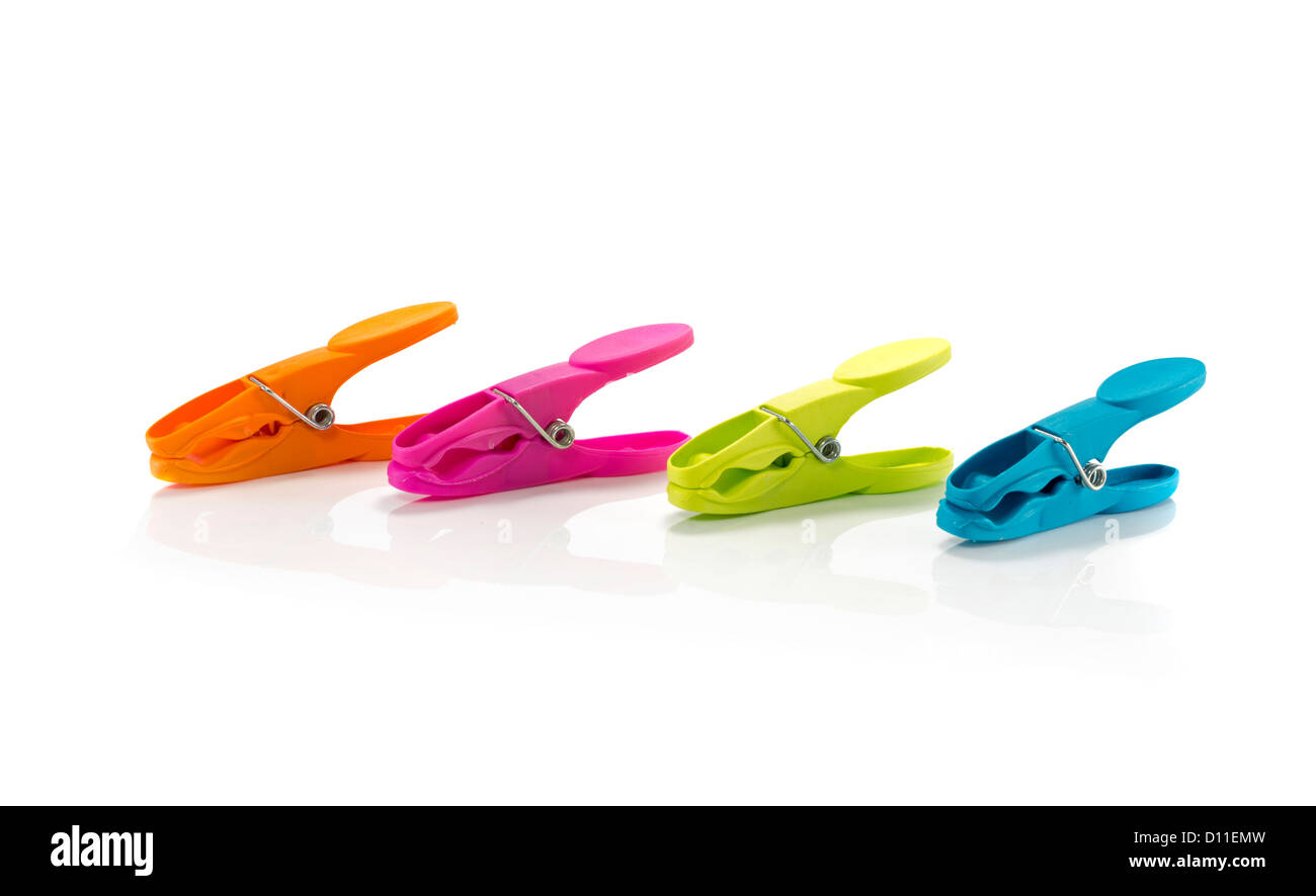 four clothespeg in green orange pink and blue Stock Photo