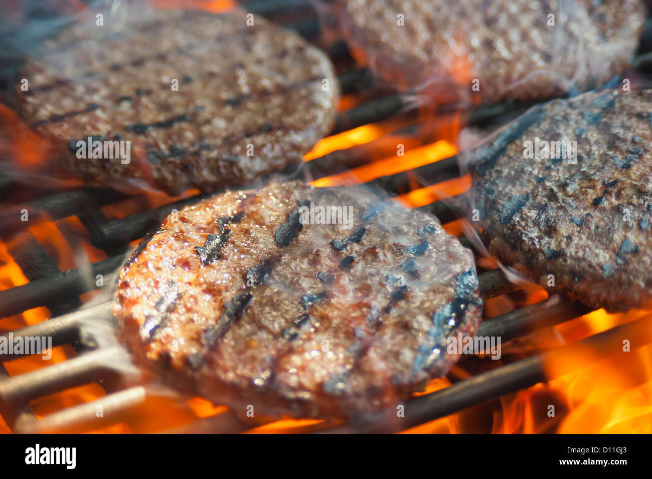 USA, Texas, Burger patties on barbecue grate Stock Photo Alamy