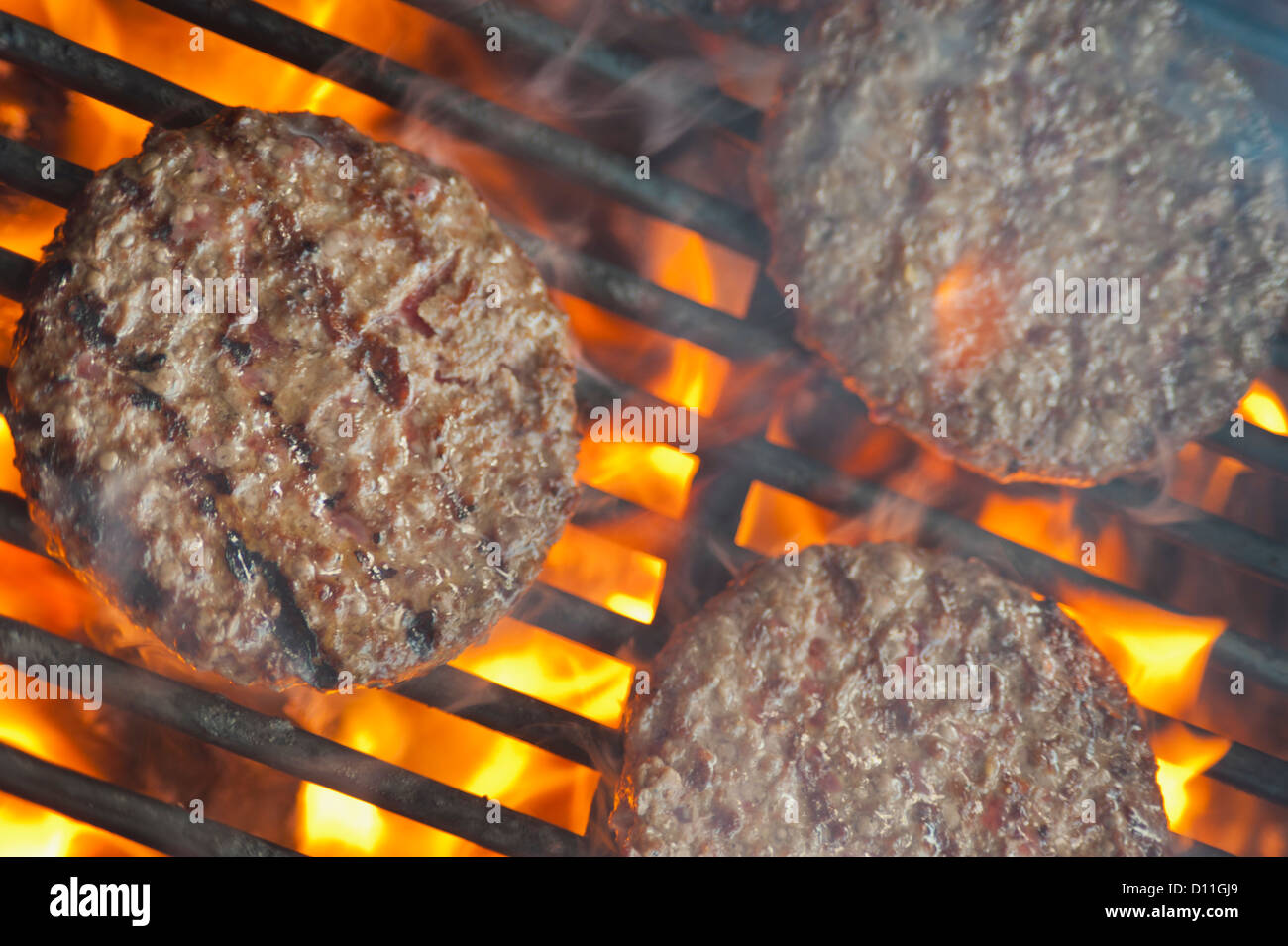 USA, Texas, Burger patties on barbecue grate Stock Photo Alamy