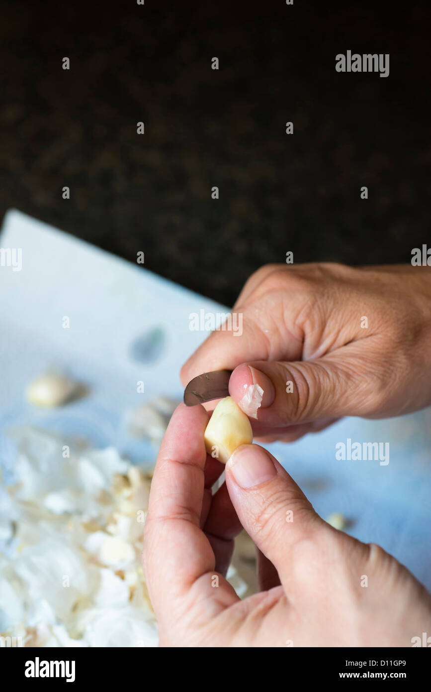 Woman peeling garlic hand on hi-res stock photography and images - Alamy