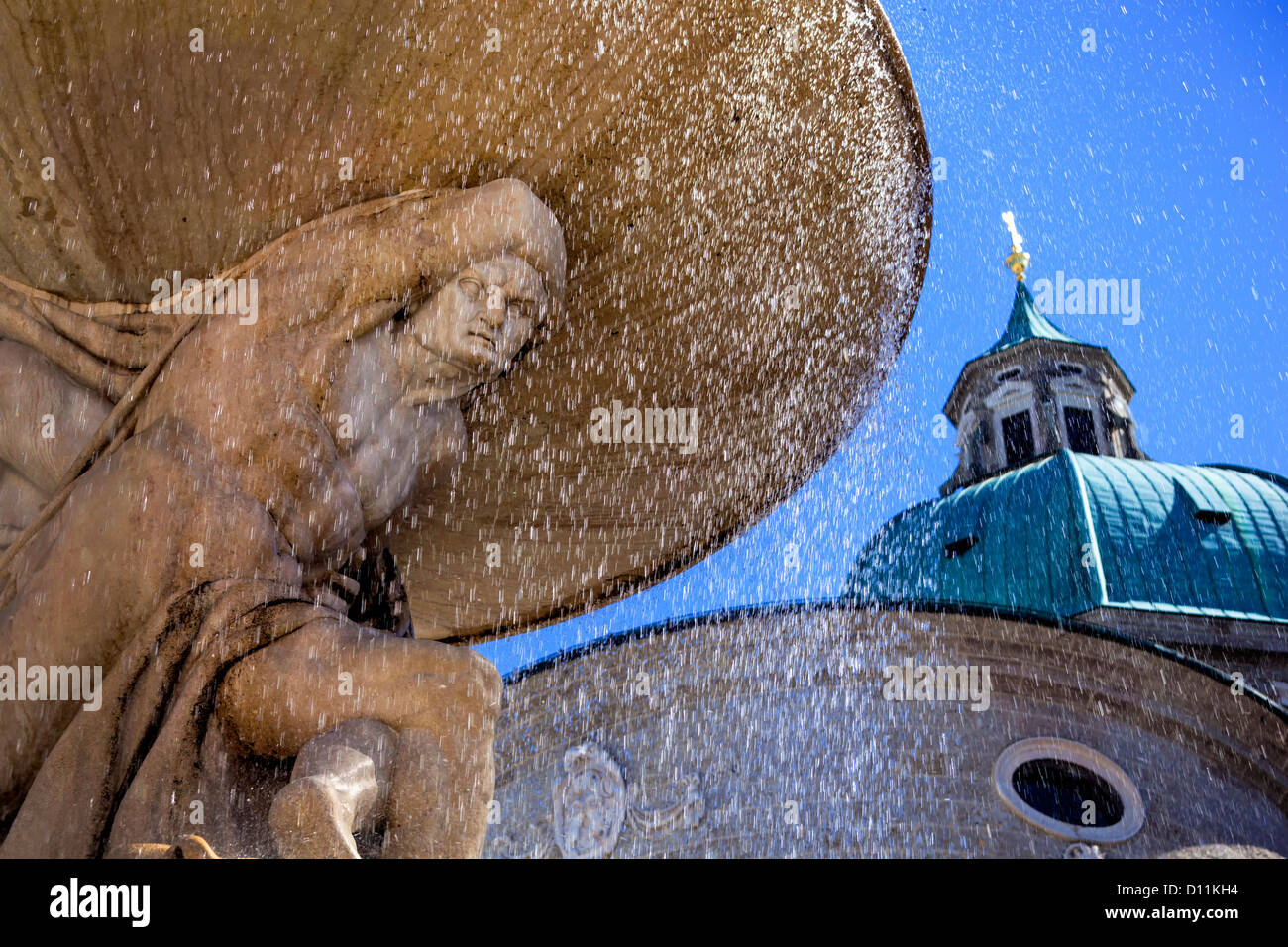 Austria, Salzburg, View of statue, Salzburg Cathedral in background Stock Photo