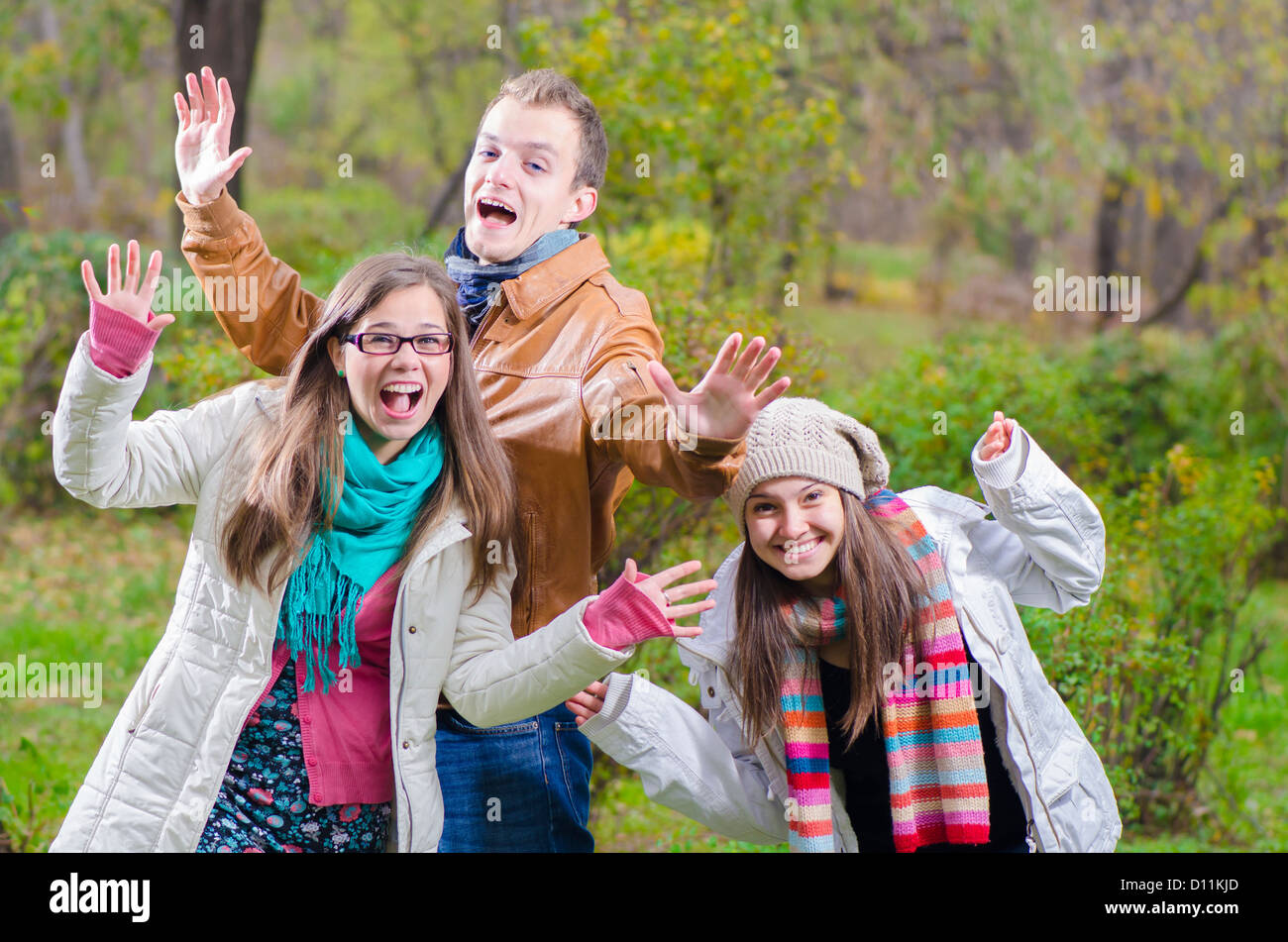 Friends Playing in the forest on autumn time Stock Photo