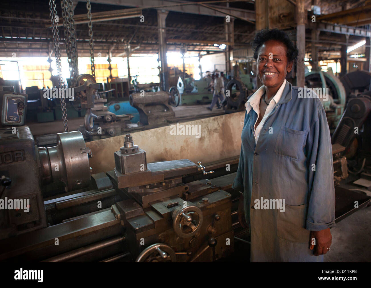 Portrait Of A Female Worker With Toothy Smile At Dire Dawa Train Station, Ethiopia Stock Photo