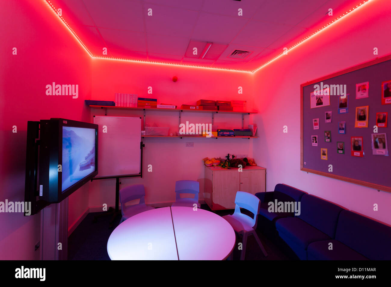 Red sensory lighting one to one classroom at special school Stock Photo