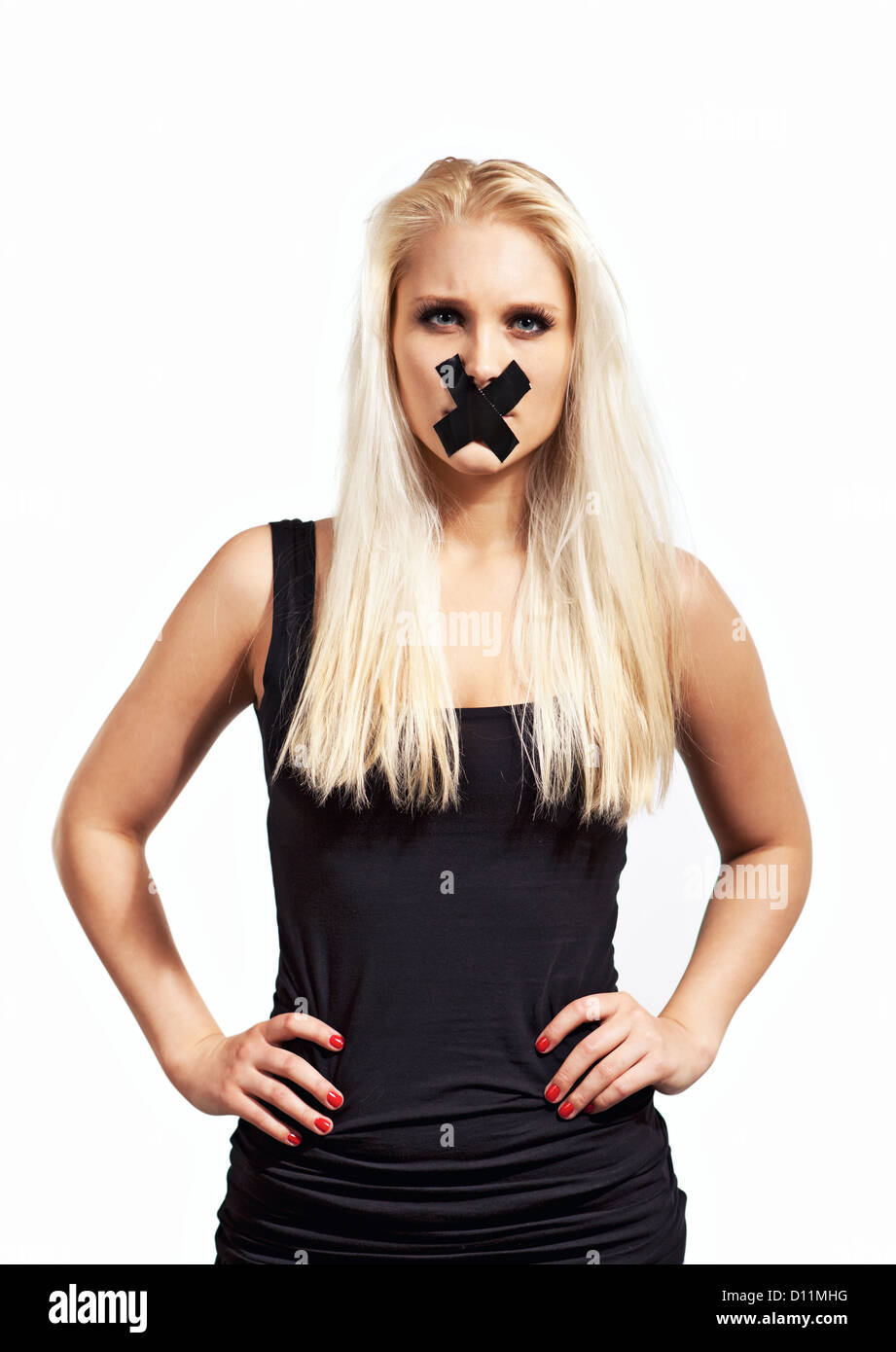 Silenced woman in protest looking angry and demanding her right for freedom of speech Stock Photo