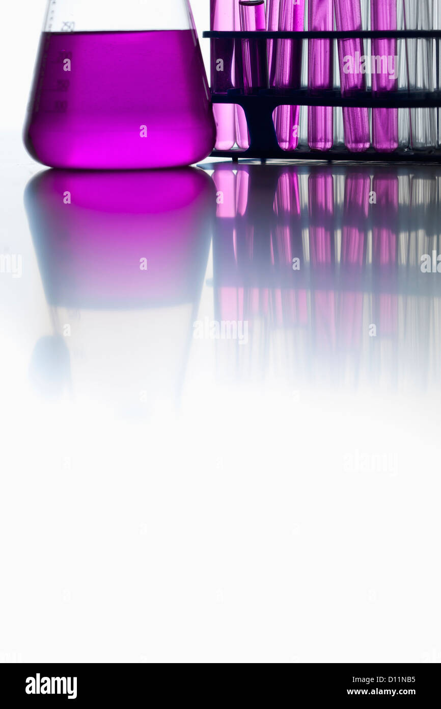 Test tubes and volumetric flask on white background, close up Stock Photo