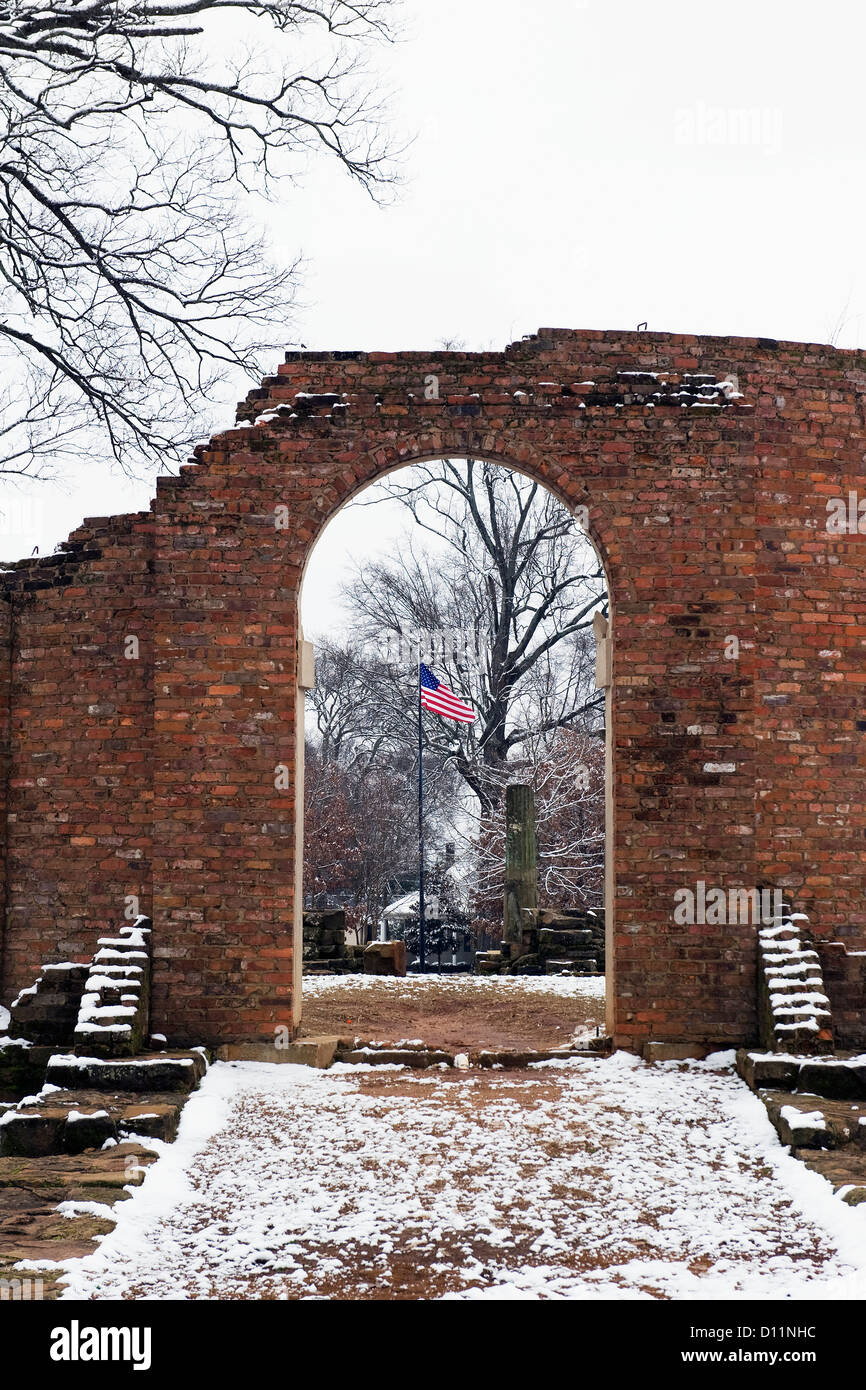 American Flag Flying Through The Archway Of The Ruins Of A Brick Wall; Tuscaloosa Alabama United States Of America Stock Photo