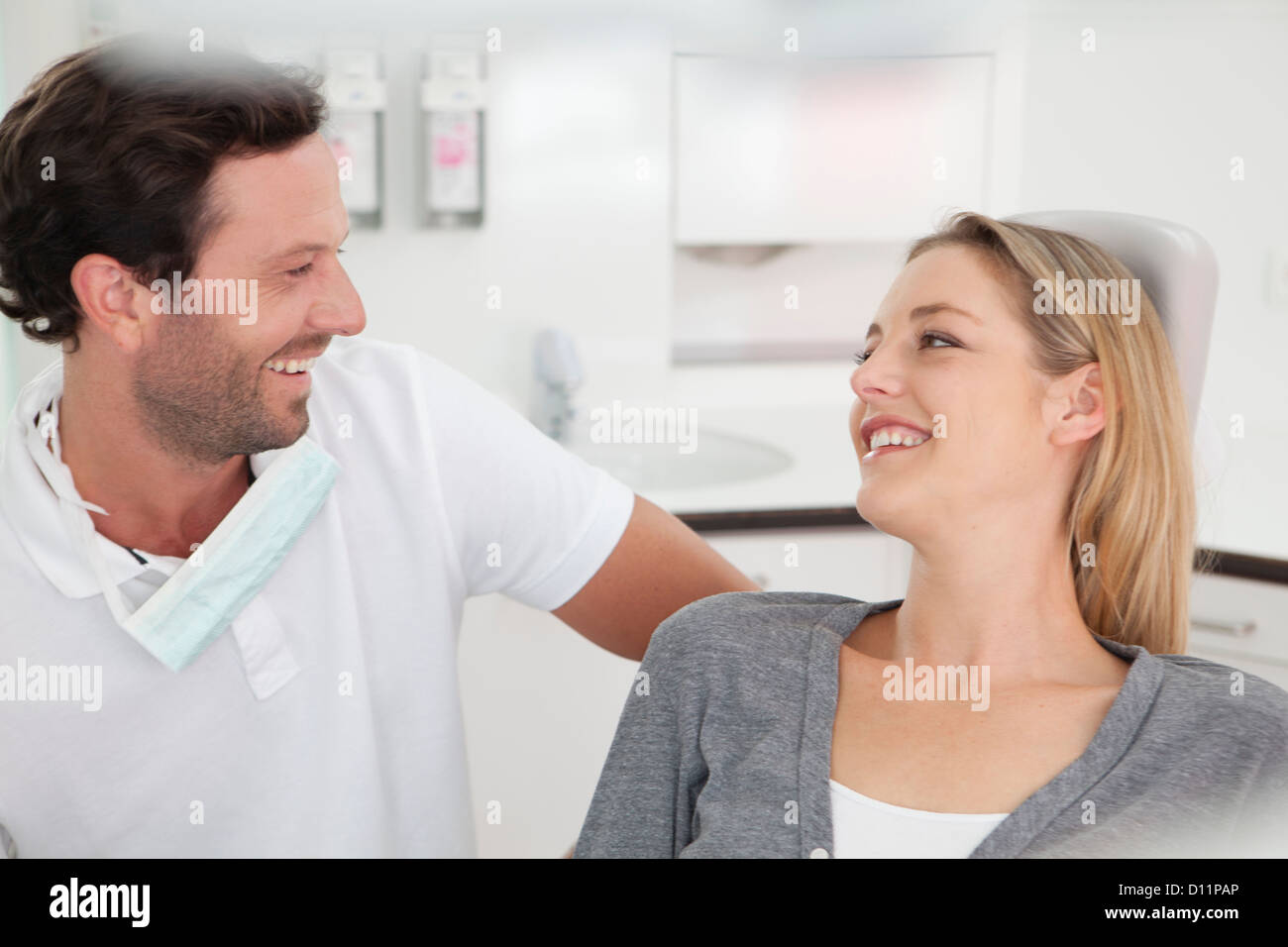 Germany, Dentist and patient in clinic, smiling Stock Photo Alamy