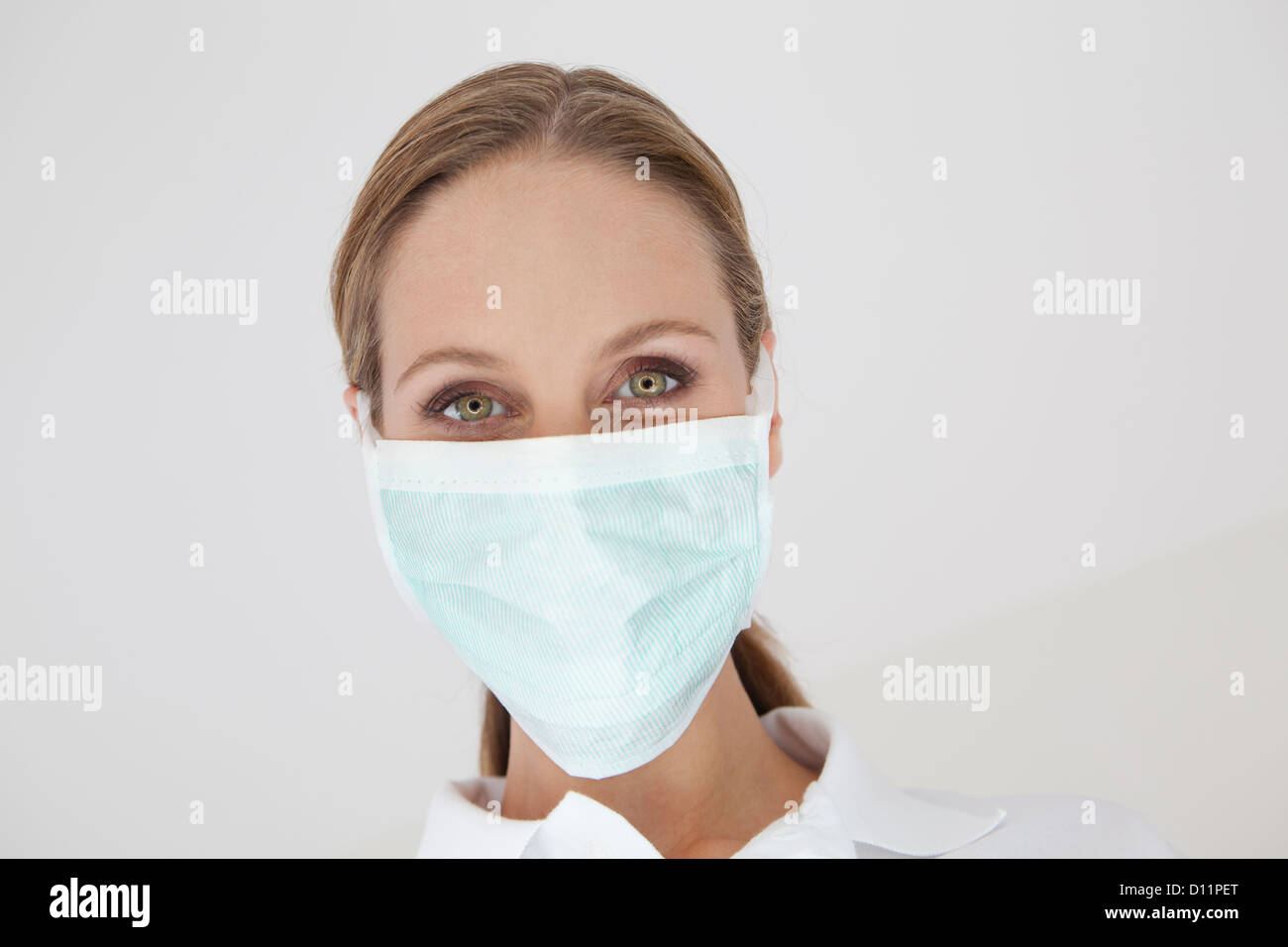 Germany, Close up of dentist with surgical mask Stock Photo