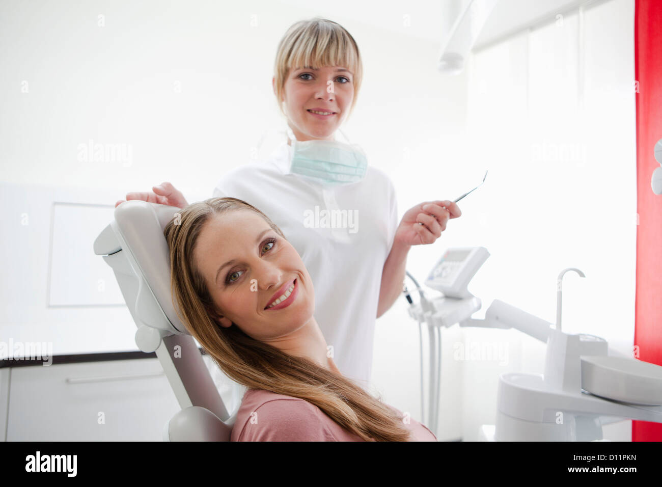 Germany, Dentist and patient, smiling, portrait Stock Photo Alamy