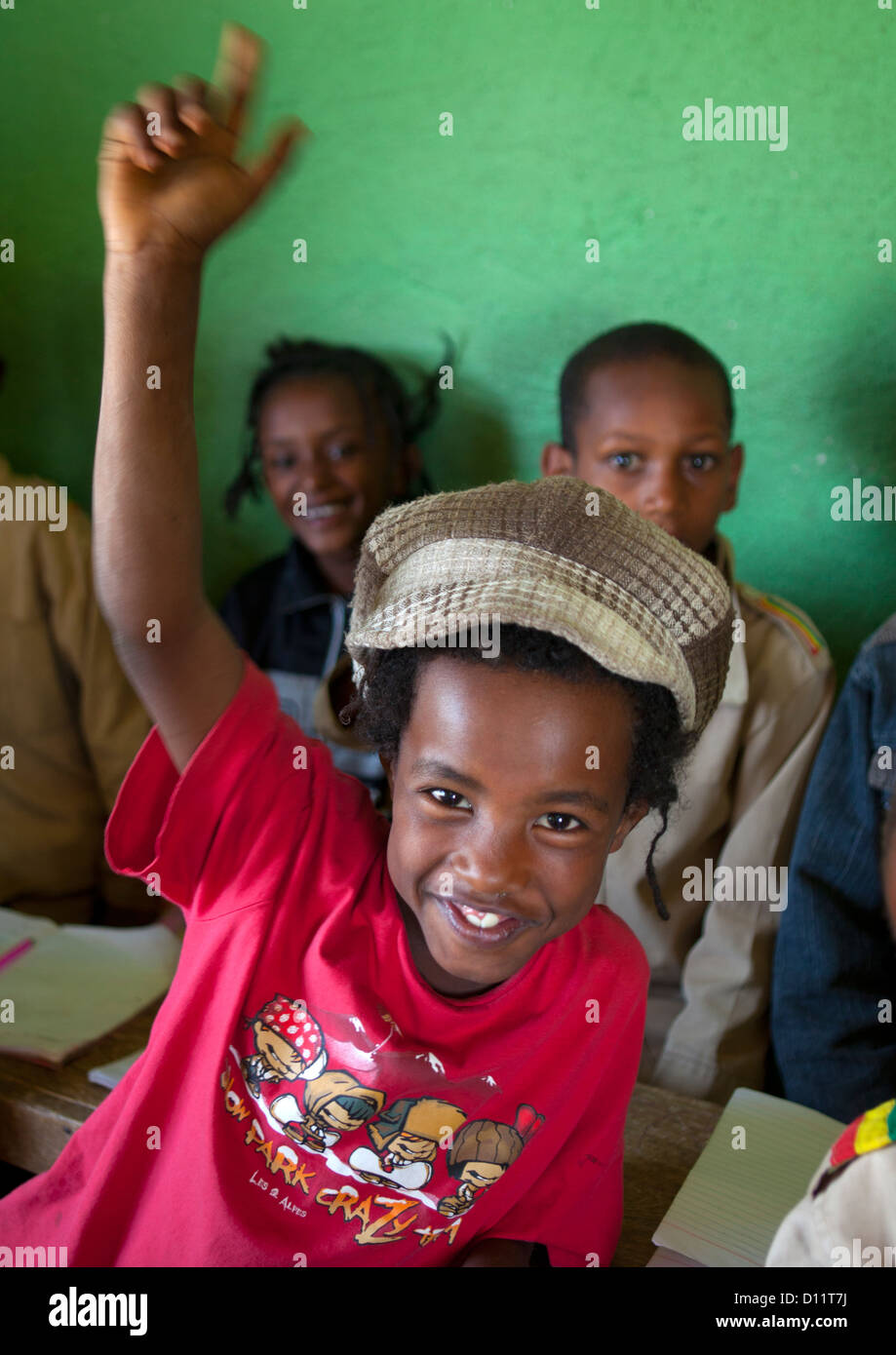 Rasta Kid Raising Hand In Shashemene Jamaican School, Oromia Region, Ethiopia Stock Photo