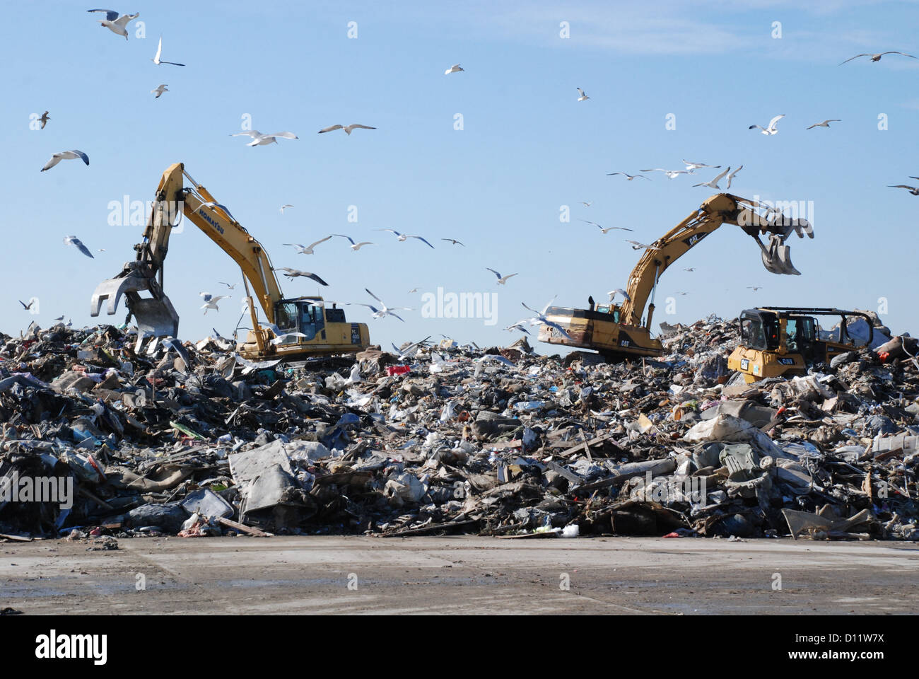 Debris is collected and then loaded onto trucks at Jacob Riis Park in Far Rockaway in Queens, N.Y., for shipping to landfills Stock Photo