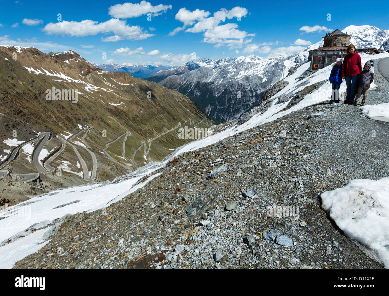 Summer Stelvio pass with alpine road and snow on slope (Italy) Stock Photo
